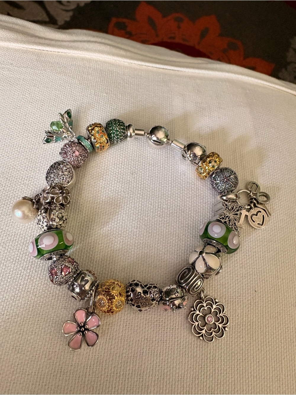 Linx bracelet with floral and bug charms